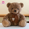 13. Bear Sits Wearing a Scarf