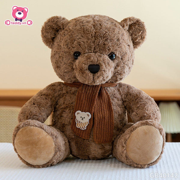 13. Bear Sits Wearing a Scarf