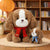 25. Sitting Dog Wearing a Scarf