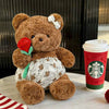 24. Teddy Bear Wearing a Shirt Holding Flowers