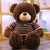 16. Giant Teddy Bear with Striped Knitted Sweater